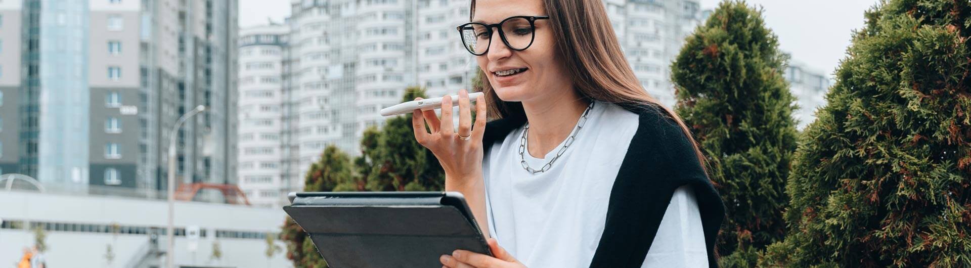 AI professional on phone holding tablet