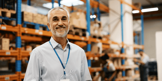 Logistics professional standing in warehouse