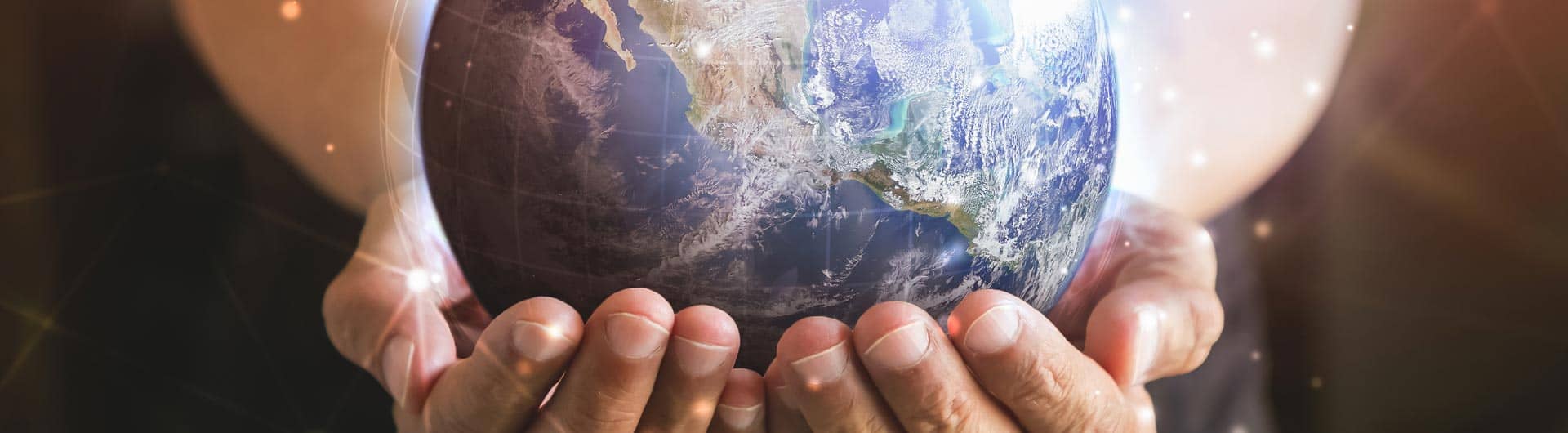 Close-up of hands holding a globe