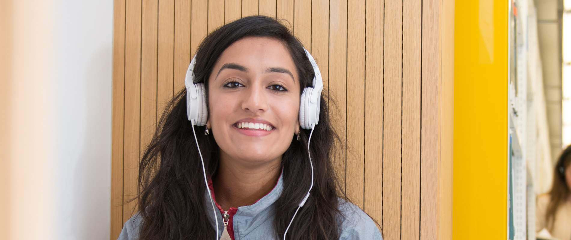 Female student wearing headphones