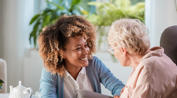 Dementia professional talking to elderly patient