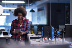 Woman working on a tablet in an office