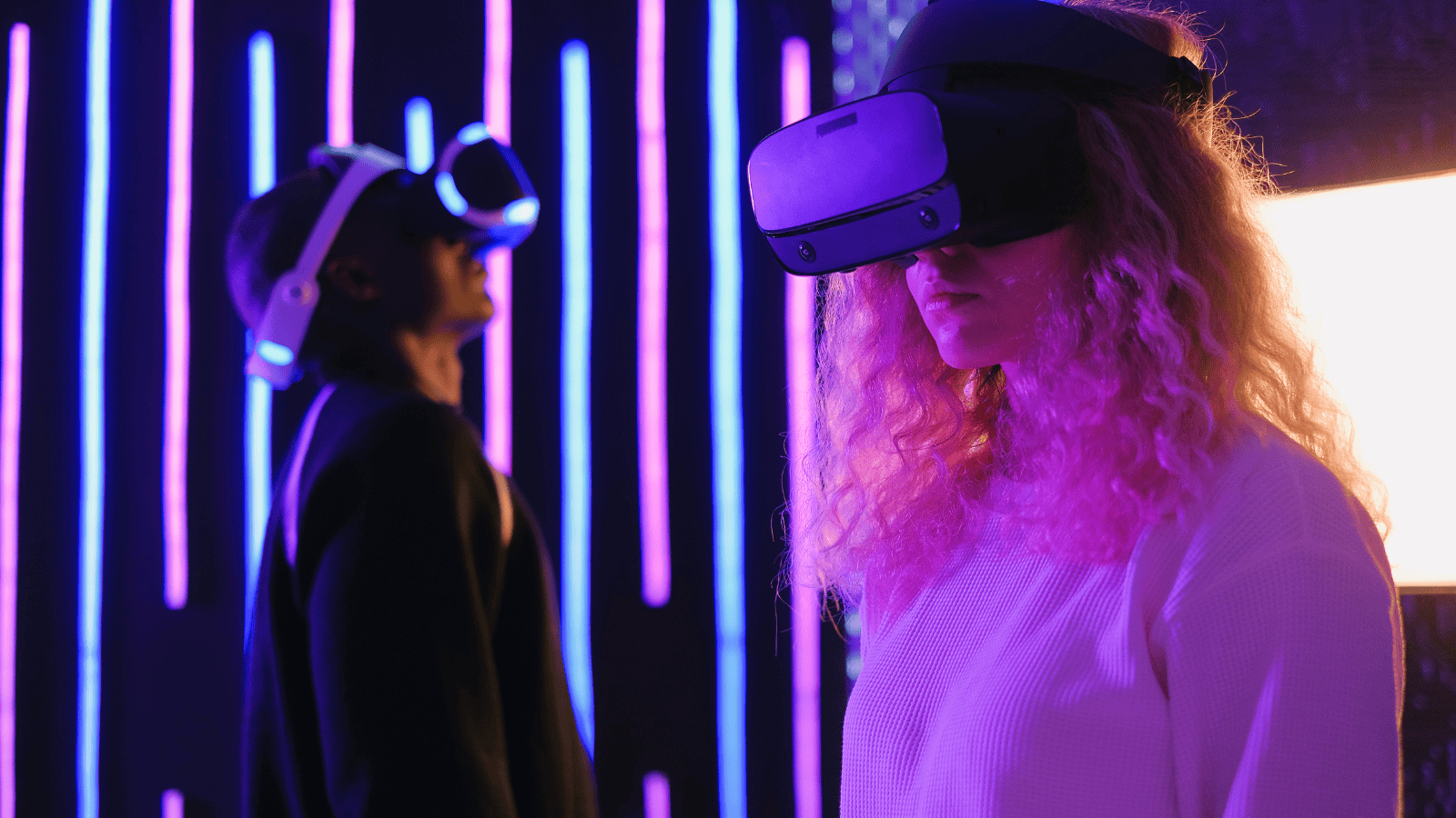 Two people using virtual reality headsets