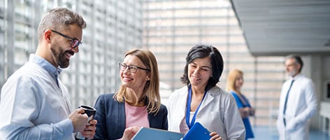 Healthcare professionals chatting in hospital setting