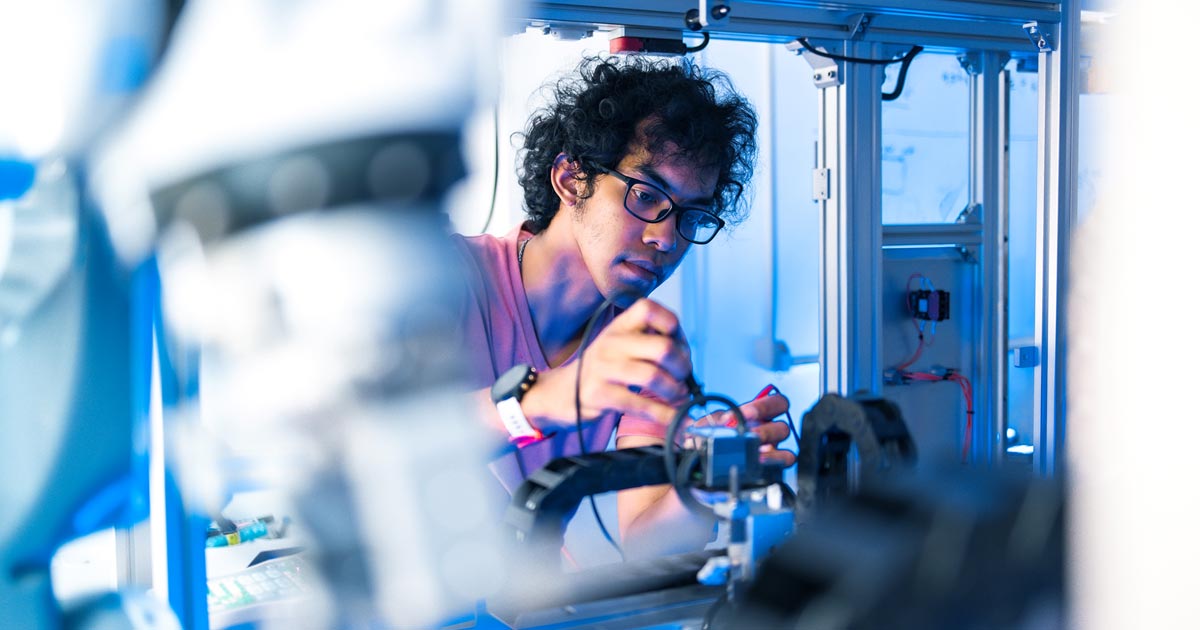 AI student working with machinery