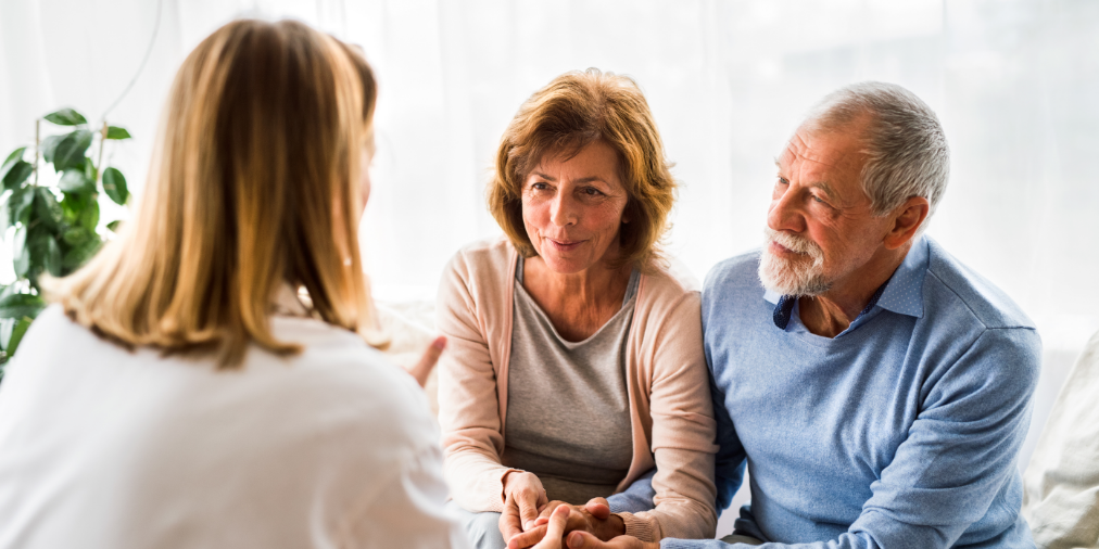 Dementia care professional speaking with patients