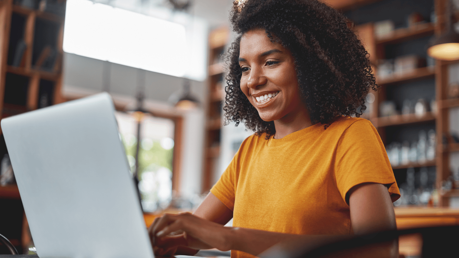 Female Hull Online student working on a laptop