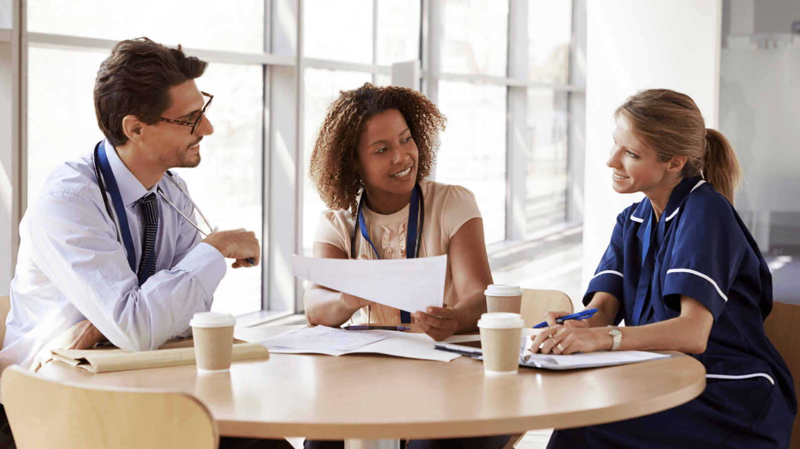 Three healthcare professionals having a meeting
